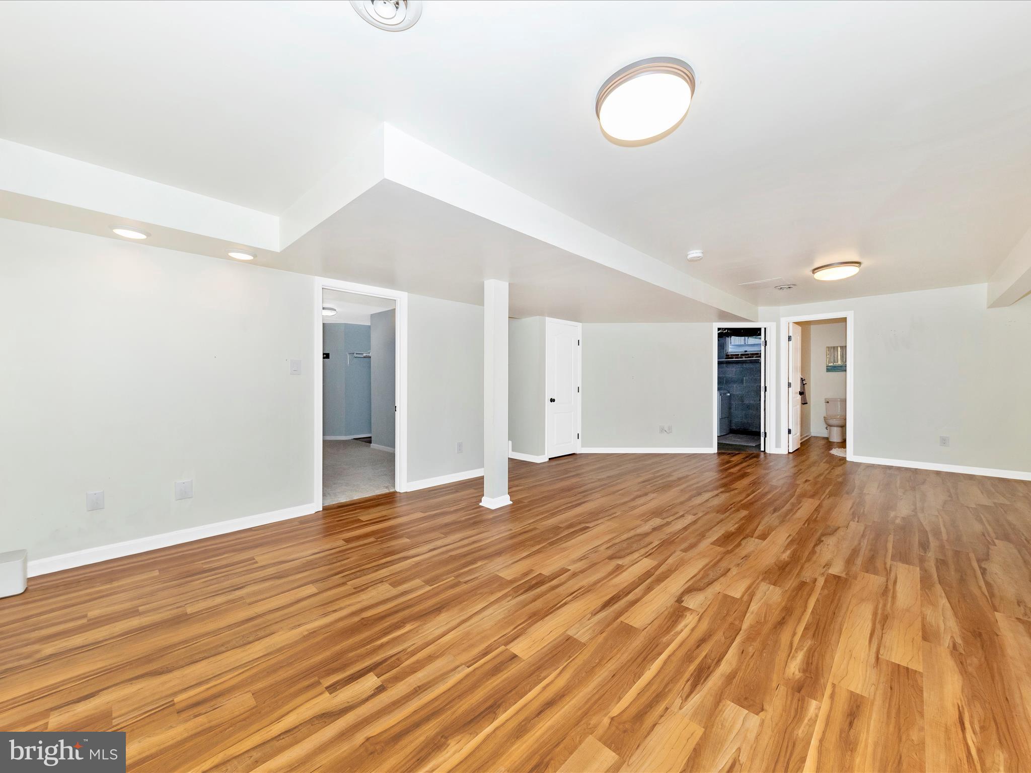 10632 Old Barn Road New Market, MD 21774 - Photo 35 of 76 a view of empty room with wooden floor