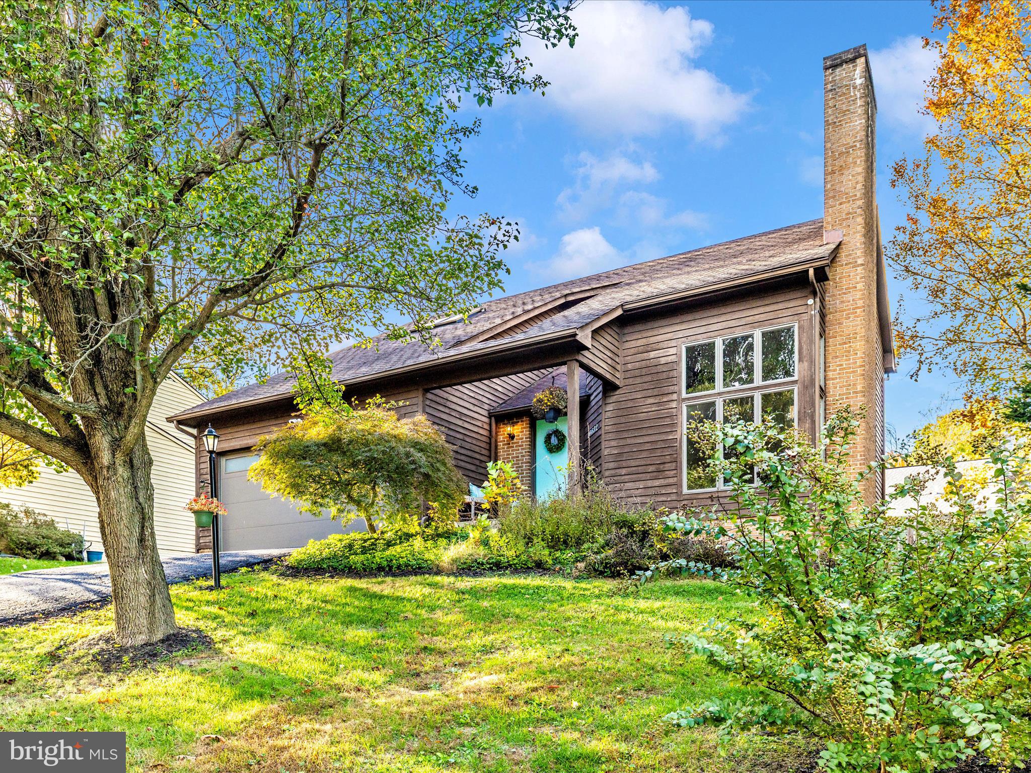 10632 Old Barn Road New Market, MD 21774 - Photo 45 of 76 a view of a house with a small yard plants and a large tree
