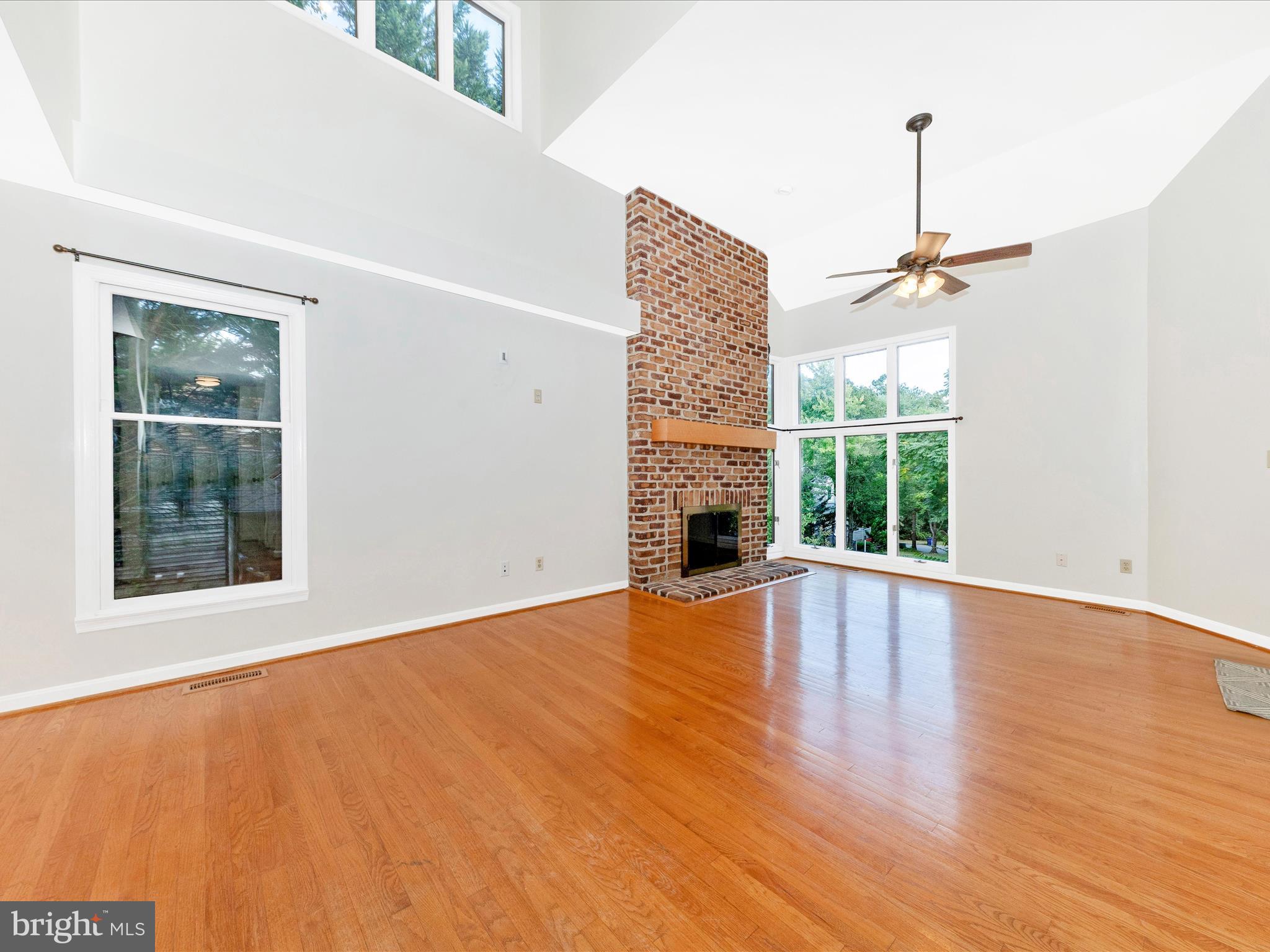 10632 Old Barn Road New Market, MD 21774 - Photo 7 of 76 a view of empty room with wooden floor and fan