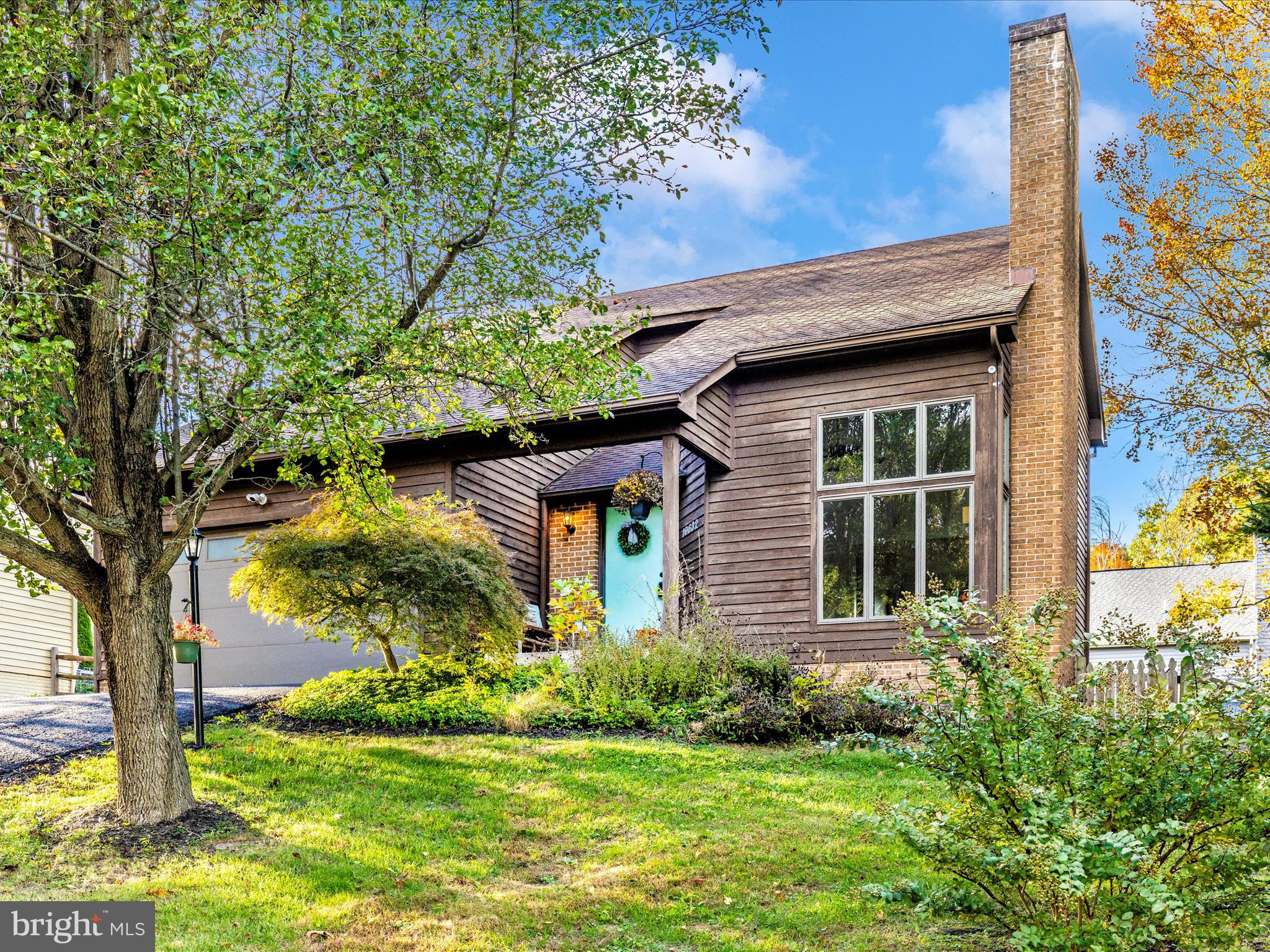 10632 Old Barn Road New Market, MD 21774 - Photo 72 of 76 a front view of a house with a yard and potted plants