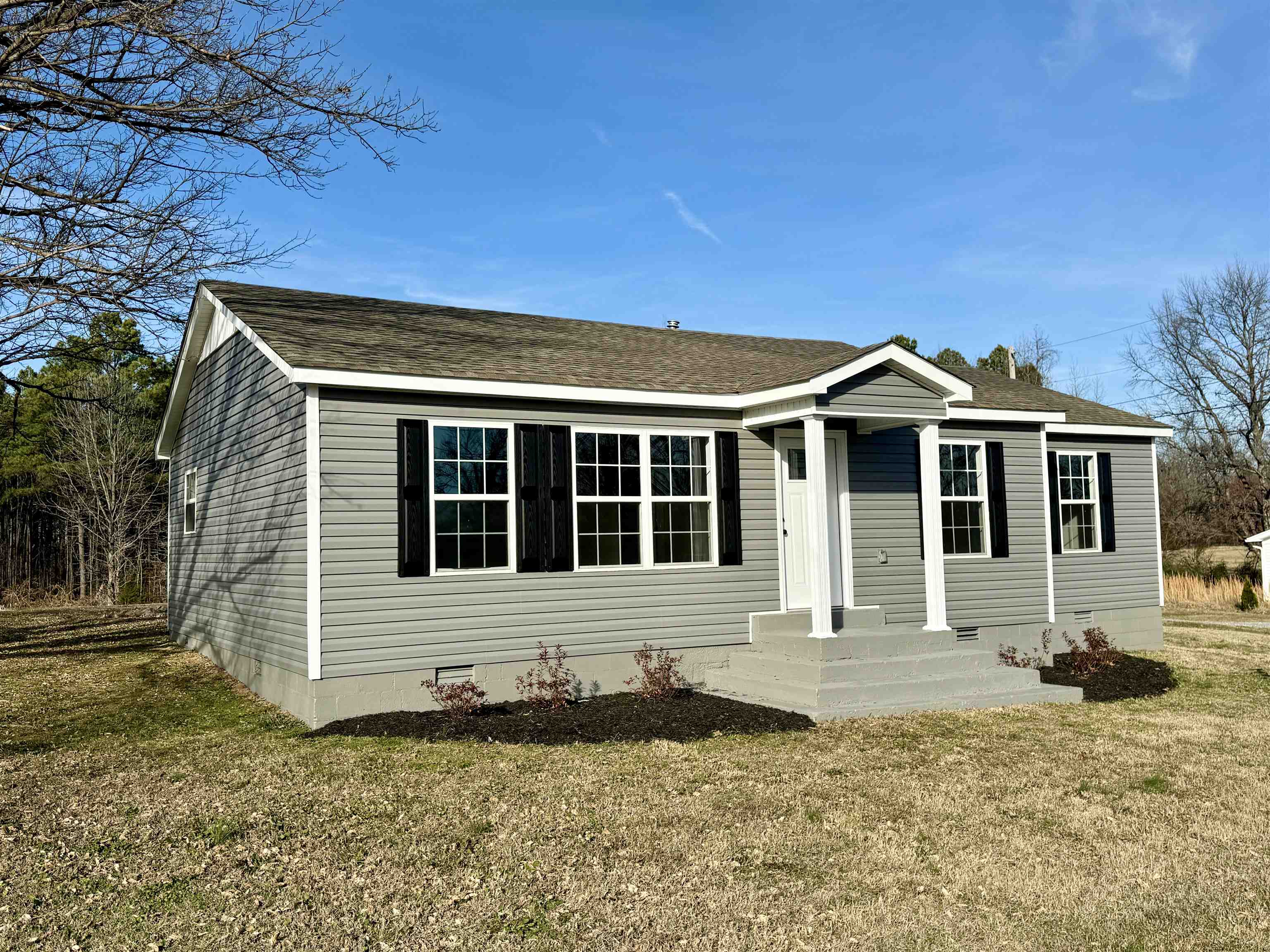 2680 Central Curve Road Ripley, TN 38063 - Photo 1 of 18 a front view of a house with a yard