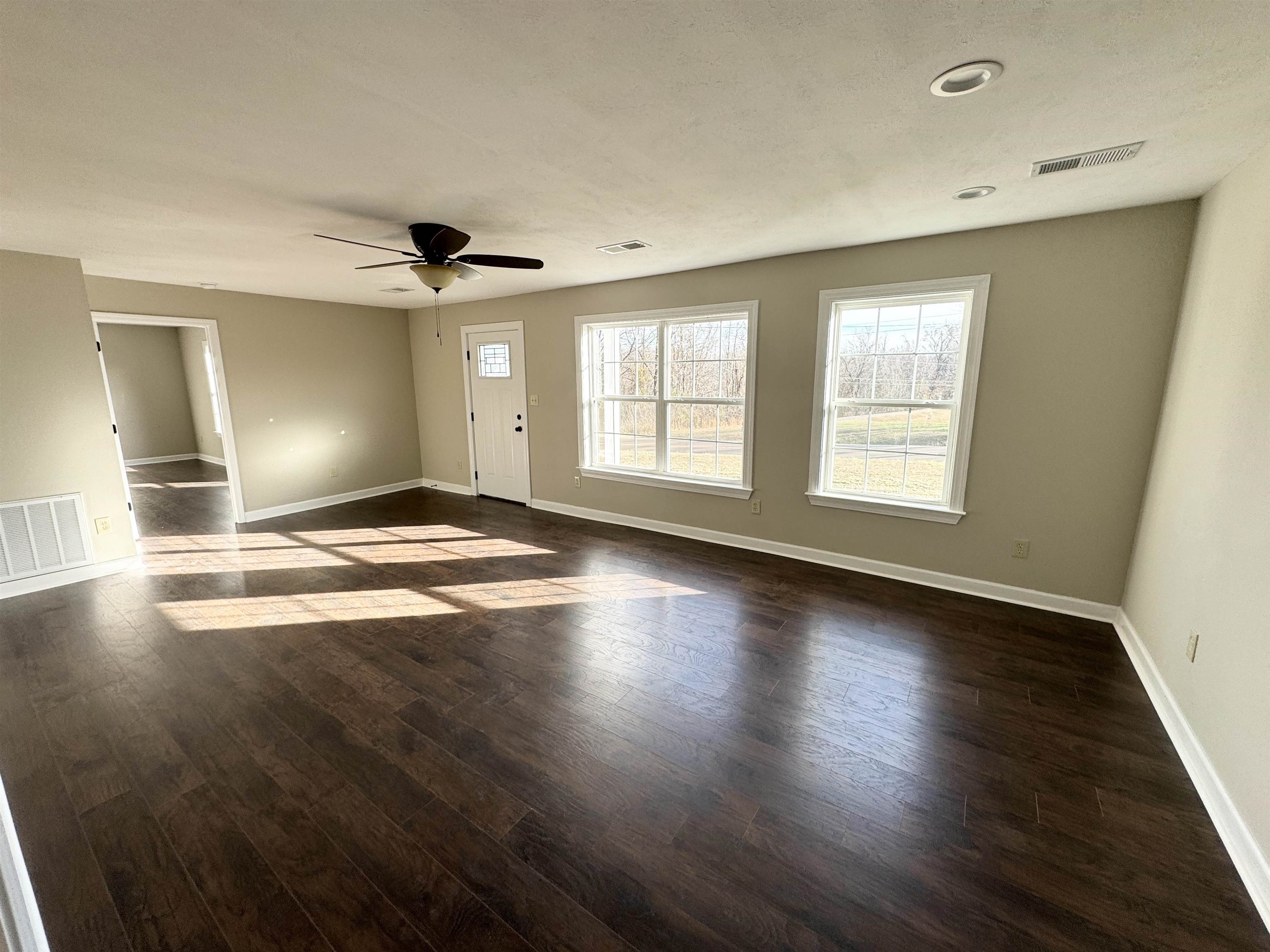 2680 Central Curve Road Ripley, TN 38063 - Photo 9 of 18 a view of an empty room with window and wooden floor