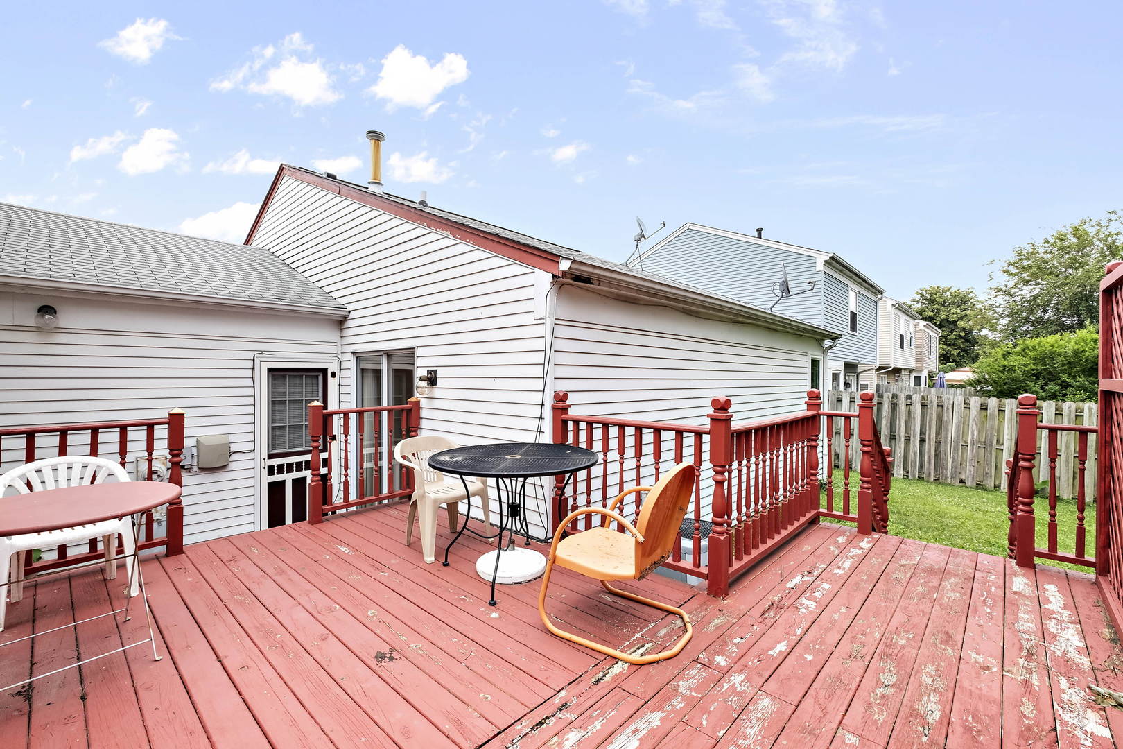 1021 Perry Drive Algonquin, IL 60102 - Photo 15 of 18 a view of a roof deck with table and chairs with wooden floor