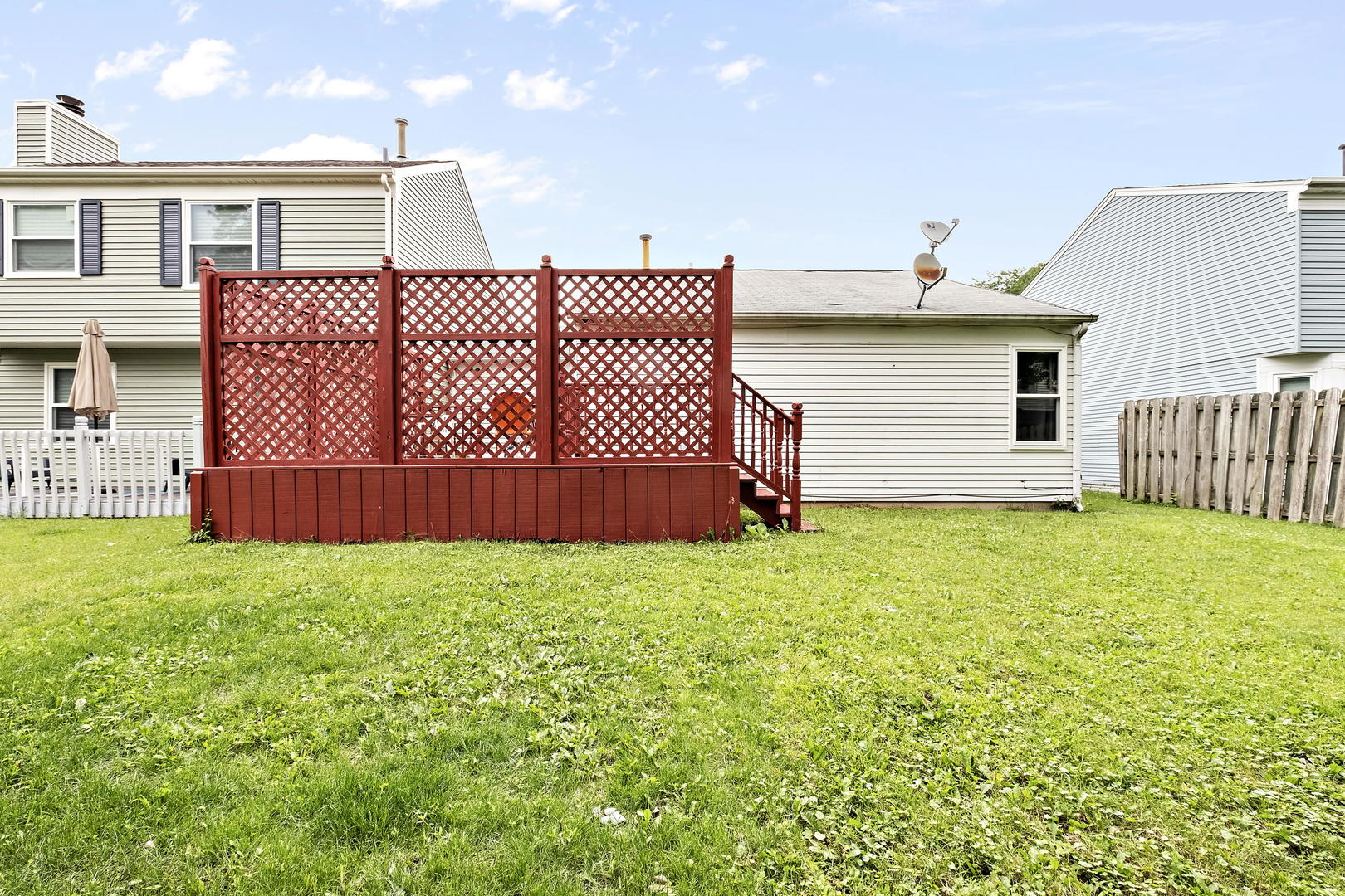 1021 Perry Drive Algonquin, IL 60102 - Photo 17 of 18 a view of a house with wooden fence
