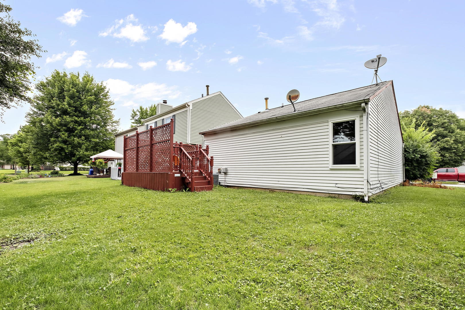 1021 Perry Drive Algonquin, IL 60102 - Photo 18 of 18 a view of a backyard with plants and a garden