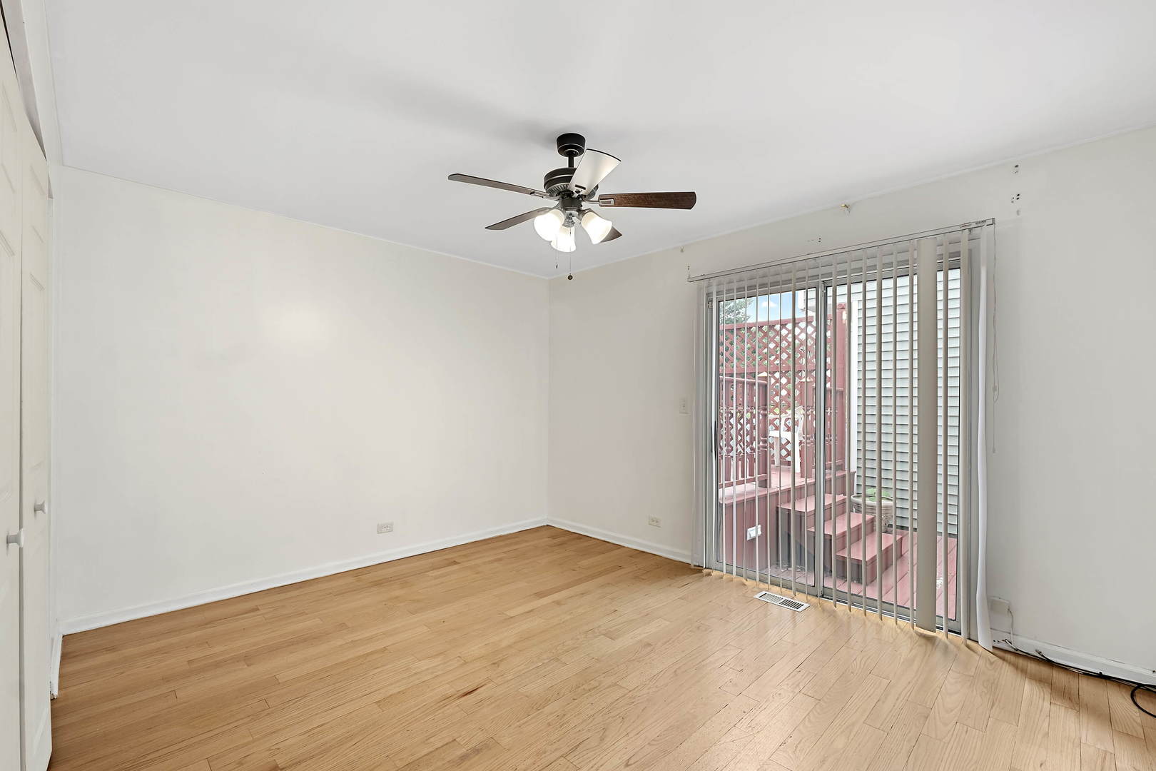 1021 Perry Drive Algonquin, IL 60102 - Photo 6 of 18 a view of a livingroom with a ceiling fan and window