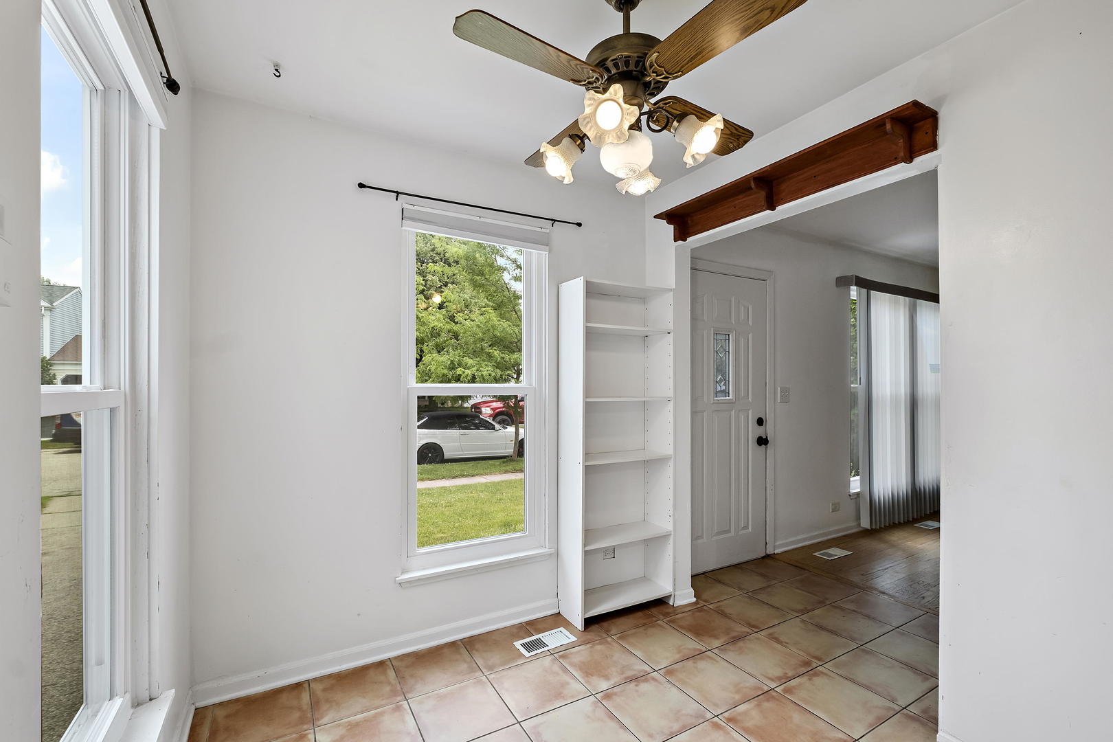 1021 Perry Drive Algonquin, IL 60102 - Photo 8 of 18 a view of an entryway with a chandelier fan