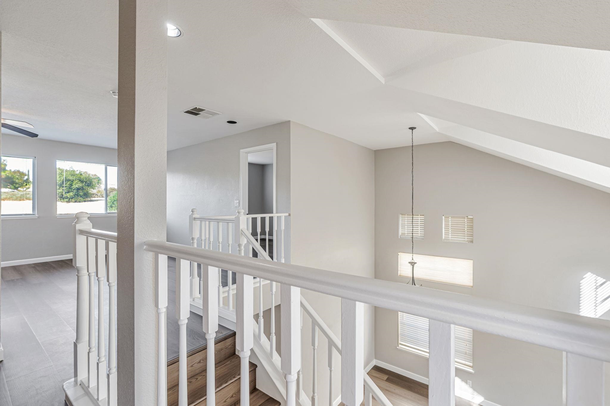 5052 Perry Way Antioch, CA 94531 - Photo 30 of 51 Corridor with an upstairs landing and wood finished floors