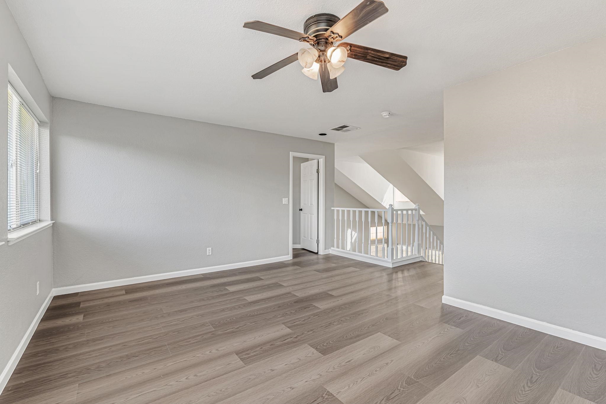 5052 Perry Way Antioch, CA 94531 - Photo 32 of 51 Spare room with light wood-type flooring and ceiling fan