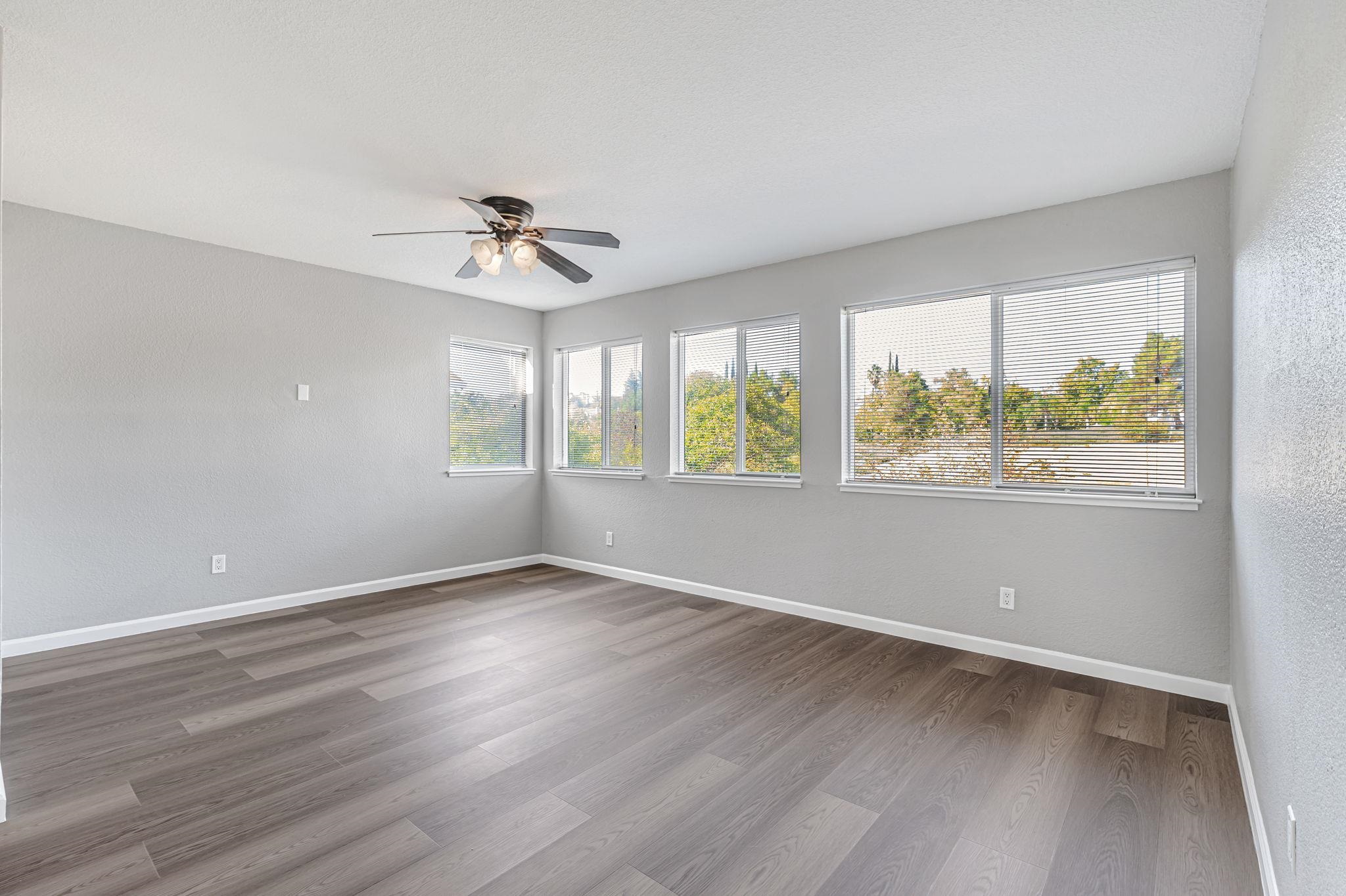 5052 Perry Way Antioch, CA 94531 - Photo 33 of 51 Spare room featuring wood finished floors and ceiling fan
