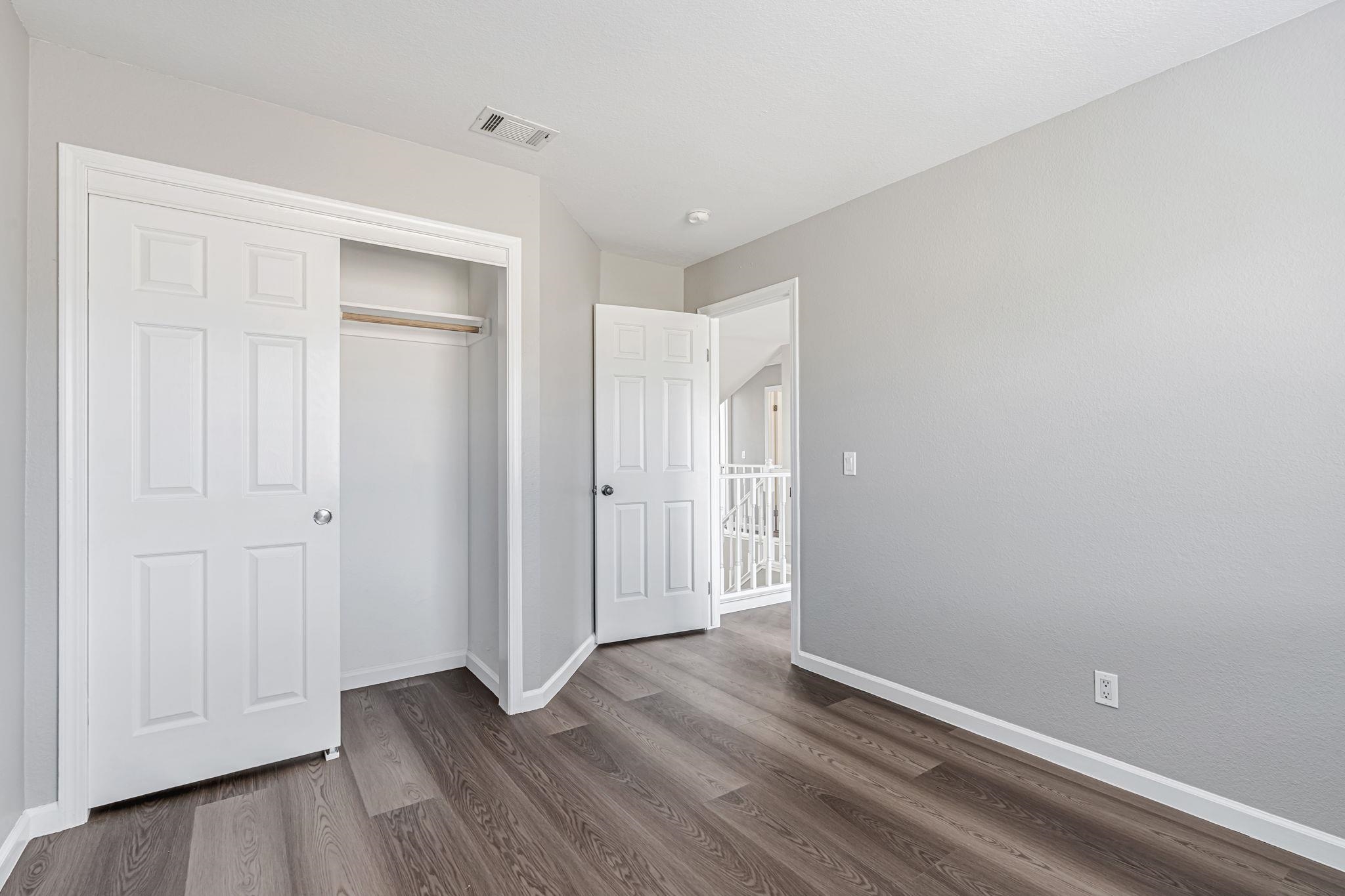 5052 Perry Way Antioch, CA 94531 - Photo 34 of 51 Unfurnished bedroom with a closet and dark wood-style flooring