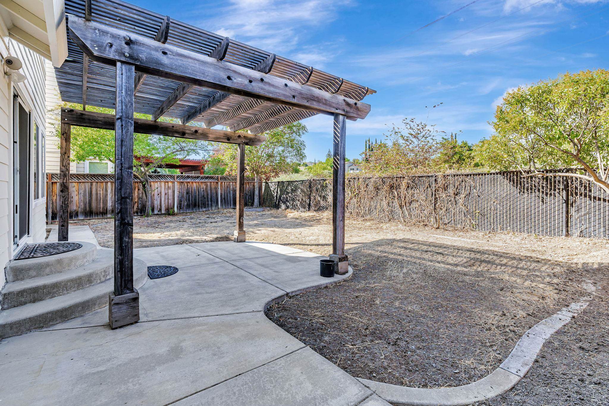 5052 Perry Way Antioch, CA 94531 - Photo 44 of 51 Fenced backyard with a patio area and a pergola
