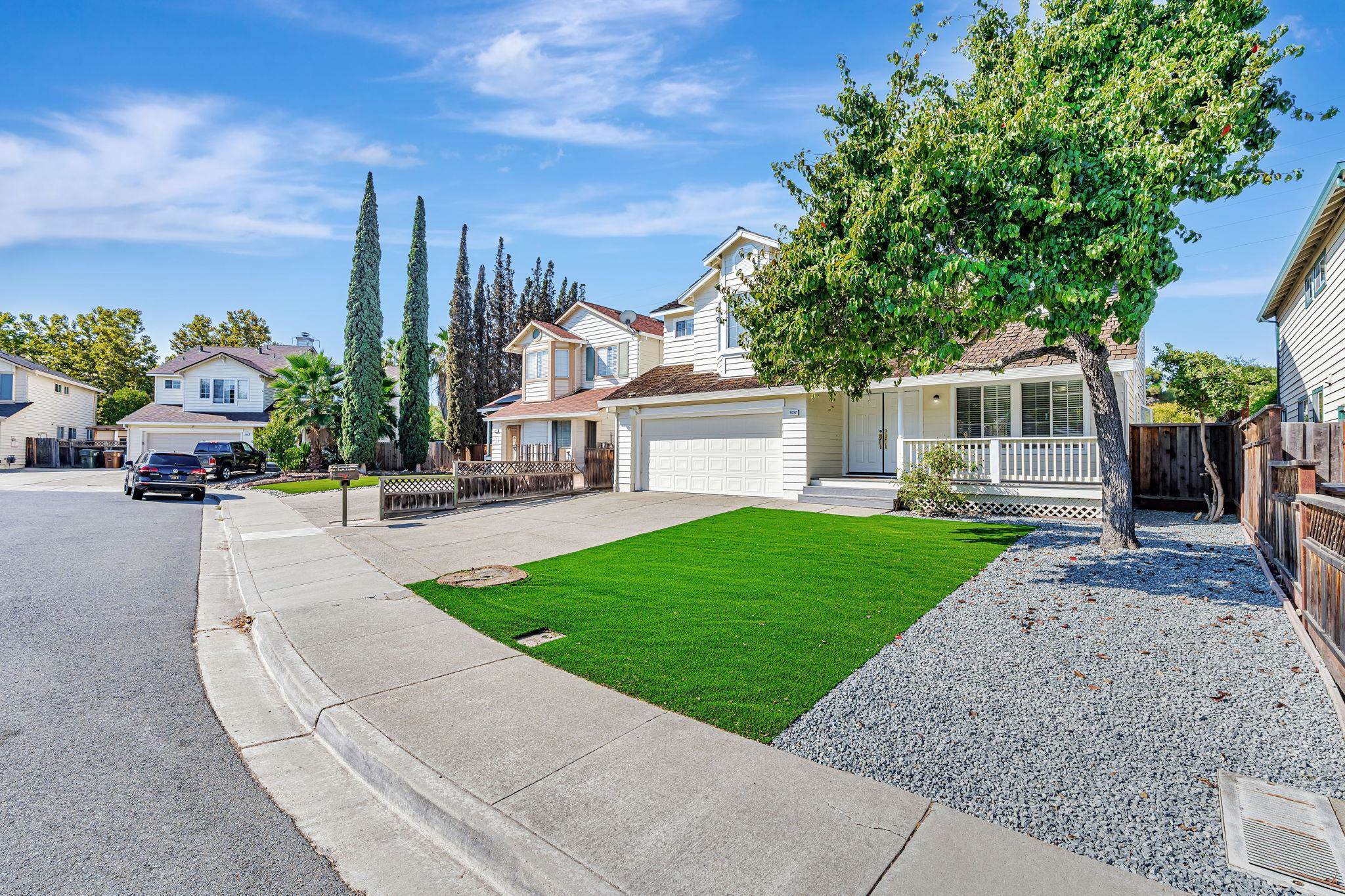 5052 Perry Way Antioch, CA 94531 - Photo 50 of 51 View of front of property featuring concrete driveway, a garage, a residential view, and covered porch