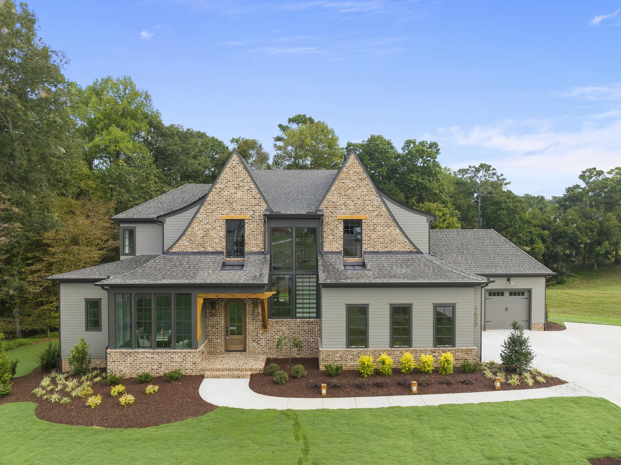 1625 Legacy Ridge Lane Wake Forest, NC 27587 - Photo 2 of 13 a front view of a house with garden