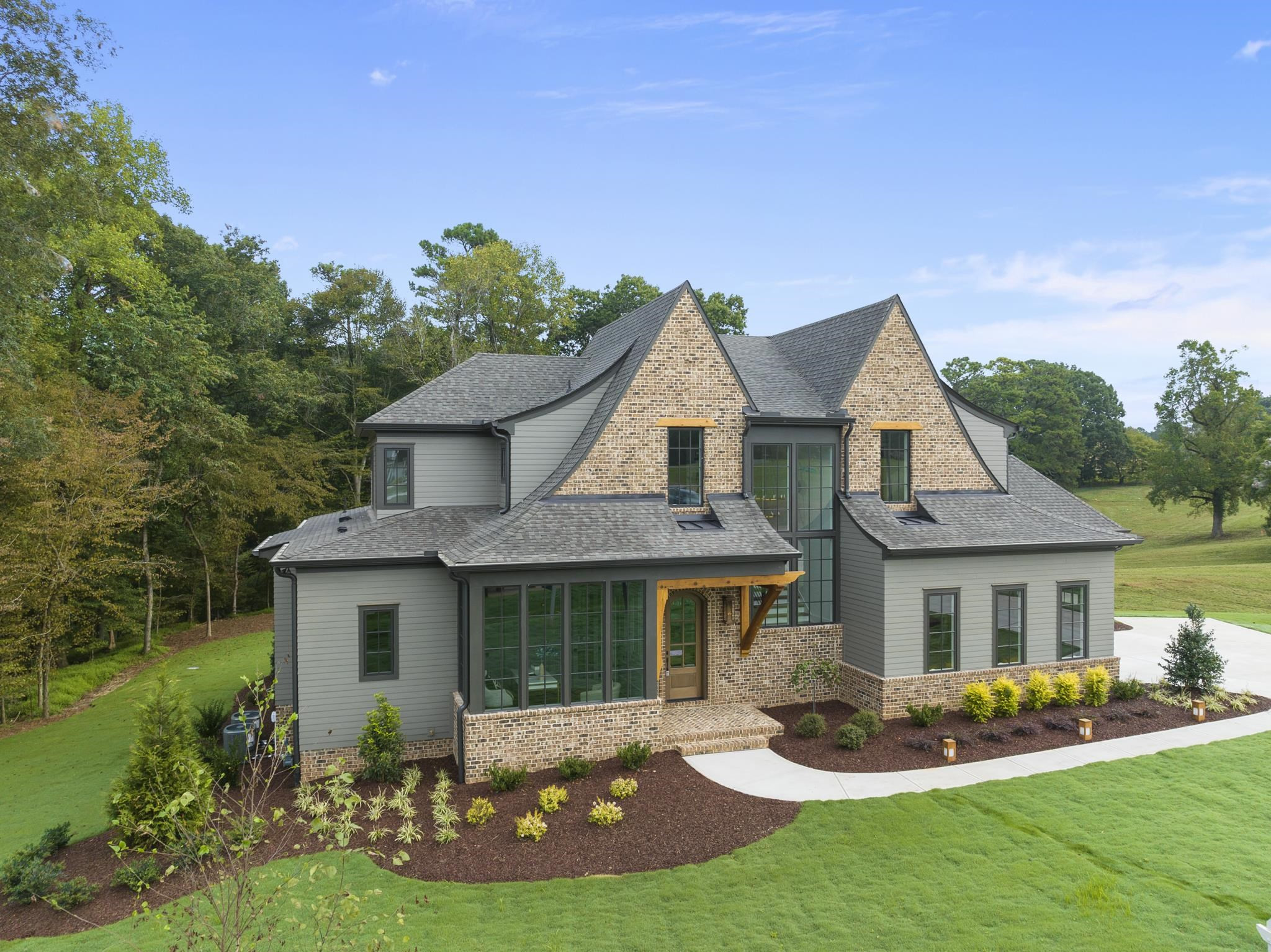 1625 Legacy Ridge Lane Wake Forest, NC 27587 - Photo 4 of 13 a front view of a house with a yard table and chairs