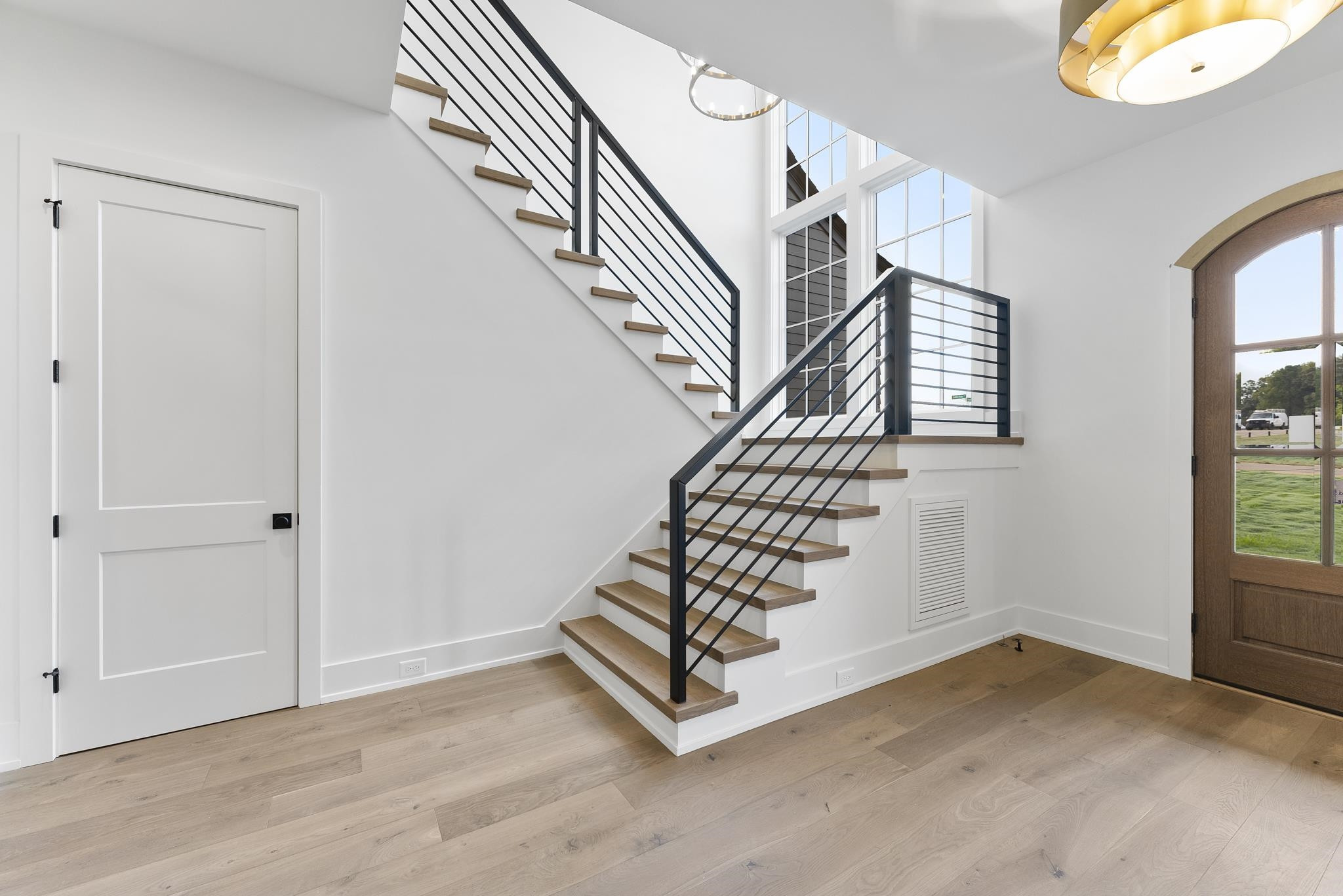1625 Legacy Ridge Lane Wake Forest, NC 27587 - Photo 8 of 13 a view of entryway with wooden floor and stairs