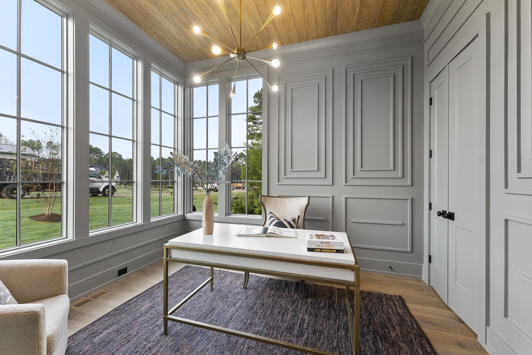 1625 Legacy Ridge Lane Wake Forest, NC 27587 - Photo 10 of 13 a living room with furniture large window and a chandelier