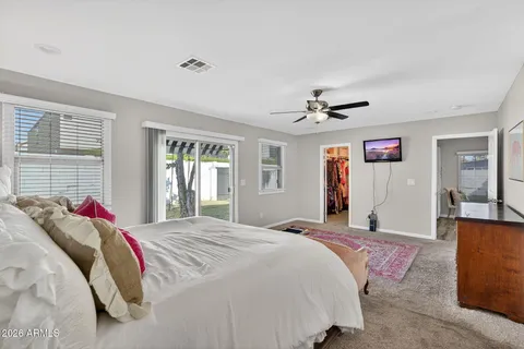 a bedroom with a bed and a table in it