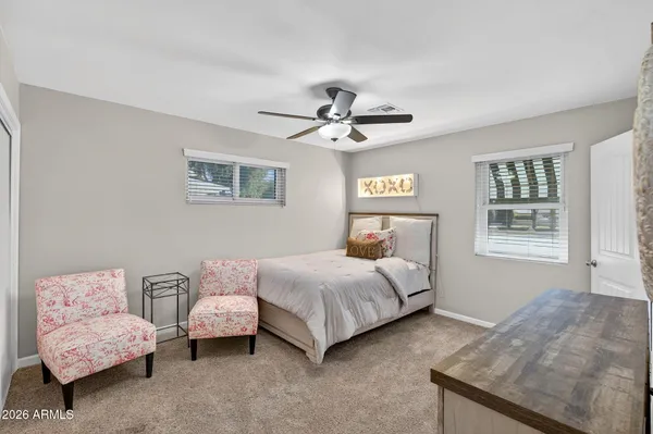 a bedroom with a bed and a closet