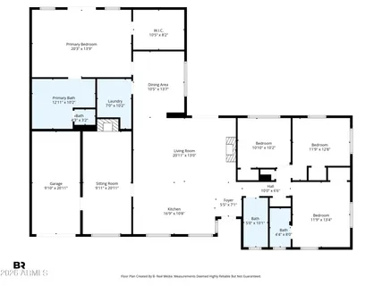 an aerial view of a house with a garden and lake view