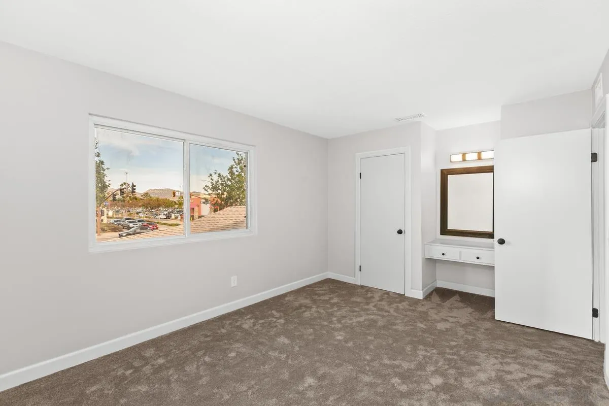 9857 Mission Gorge Road, Unit 2 Santee, CA 92071 - Photo 8 of 11 an empty room with a window and closet