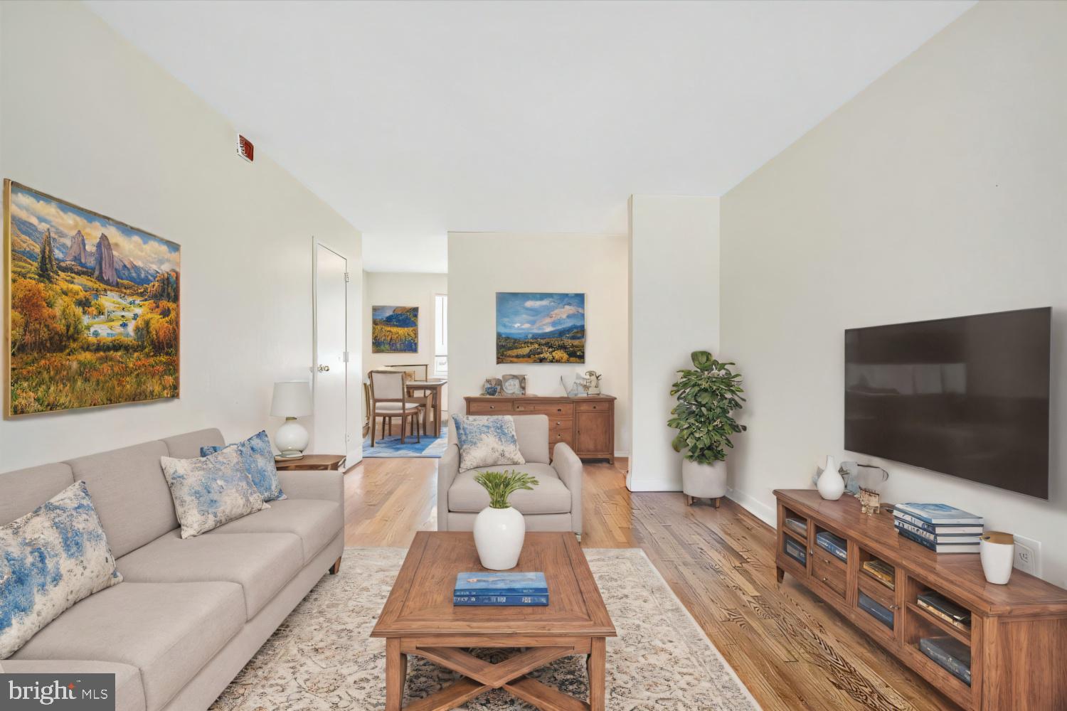 8204 South 82nd Street, Unit A Philadelphia, PA 19153 - Photo 2 of 4 a living room with furniture and a flat screen tv