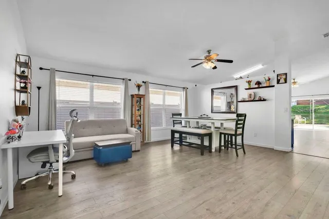 a view of a livingroom with furniture and a table and chairs