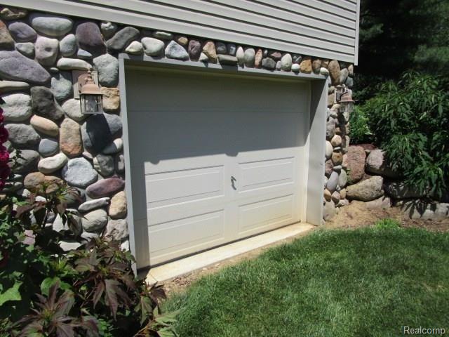 10382 Horton Road Goodrich, MI 48438 - Photo 13 of 72 Finished lower level 1.5 car heated garage w/220 service