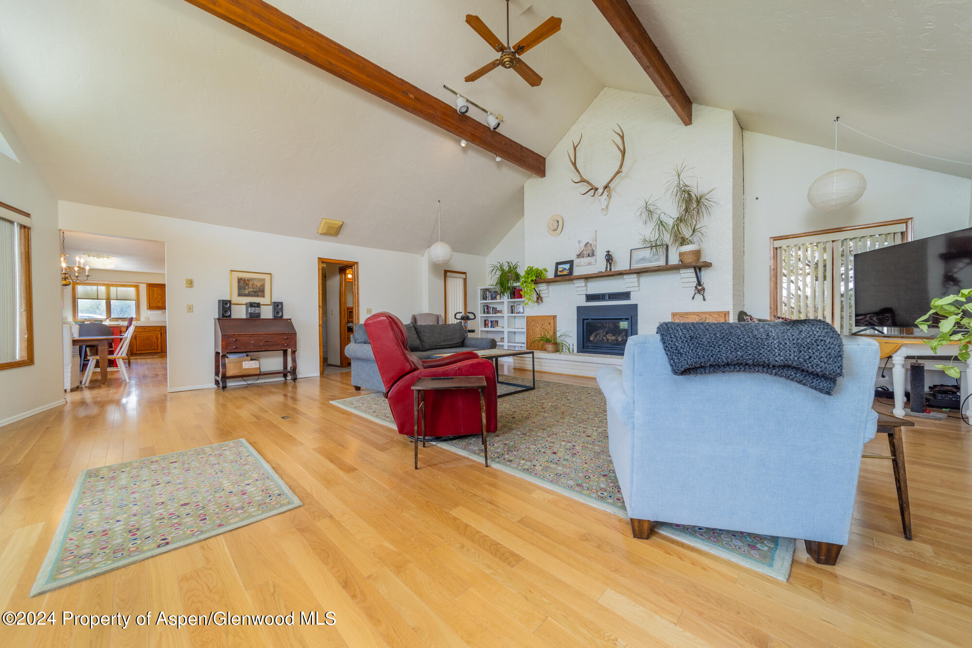 1501 14 Road Loma, CO 81524 - Photo 13 of 27 a living room with furniture and a flat screen tv