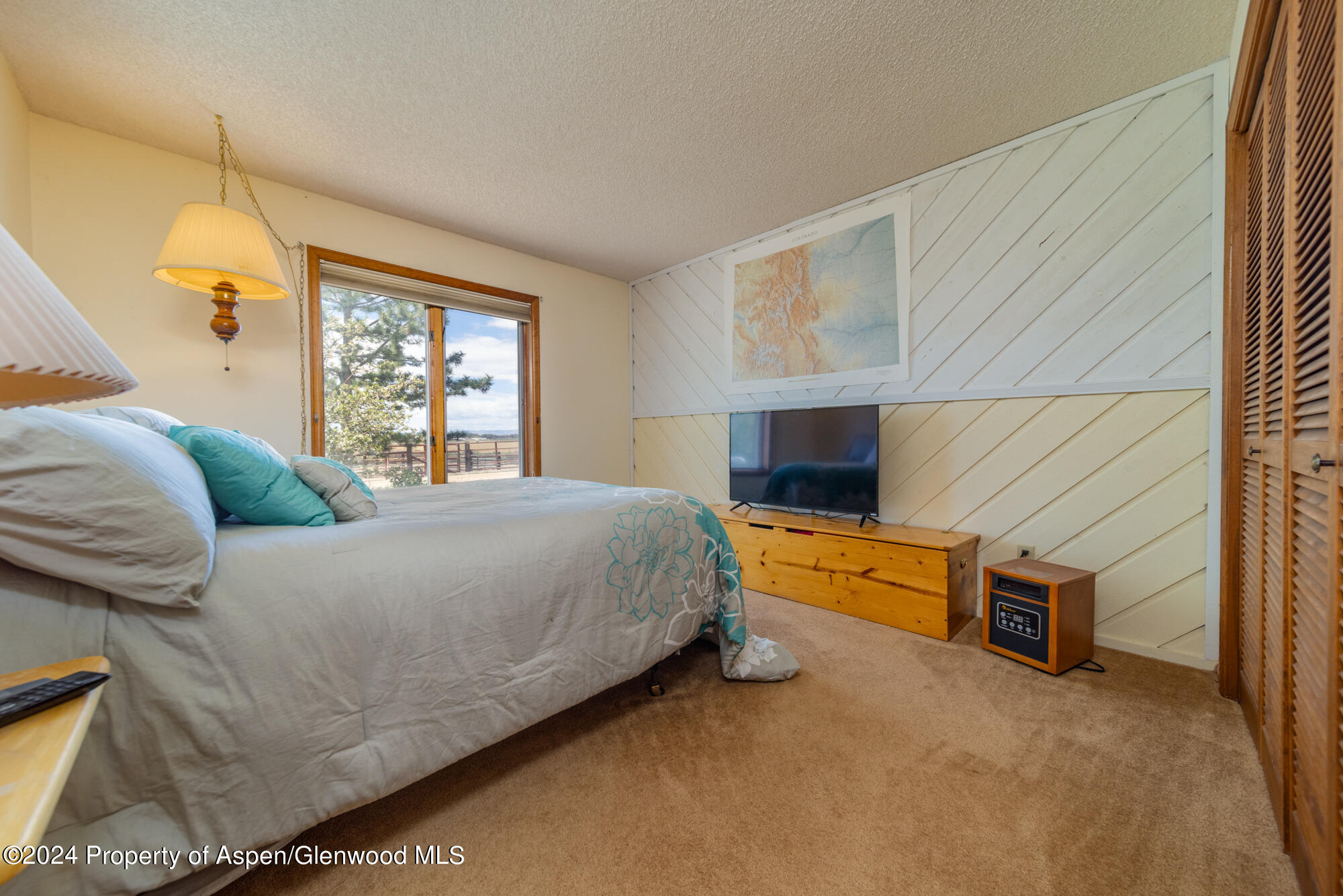 1501 14 Road Loma, CO 81524 - Photo 19 of 27 a bedroom with a bed and a couch