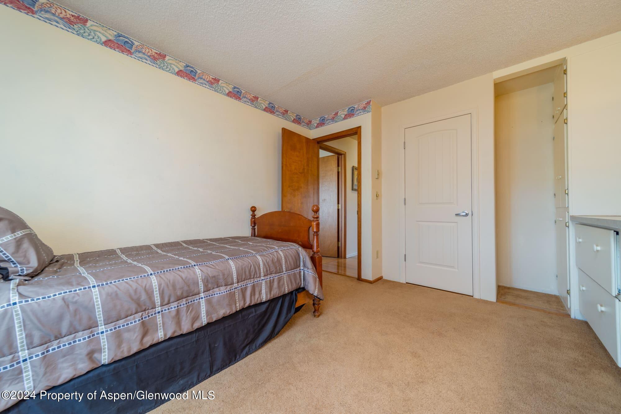 1501 14 Road Loma, CO 81524 - Photo 22 of 27 a bedroom with a bed and a window