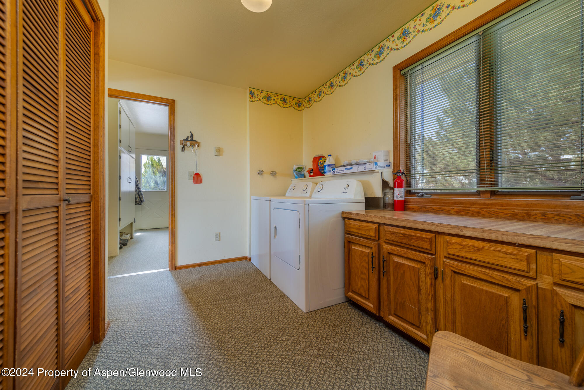 1501 14 Road Loma, CO 81524 - Photo 26 of 27 a view of a hallway with washer and dryer