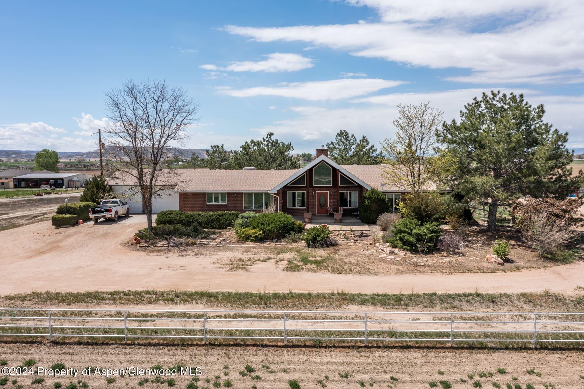 1501 14 Road Loma, CO 81524 - Photo 8 of 27 a front view of a house with a yard