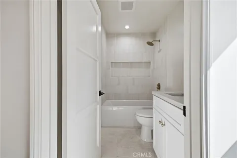 a bathroom with a toilet a sink and a bathtub