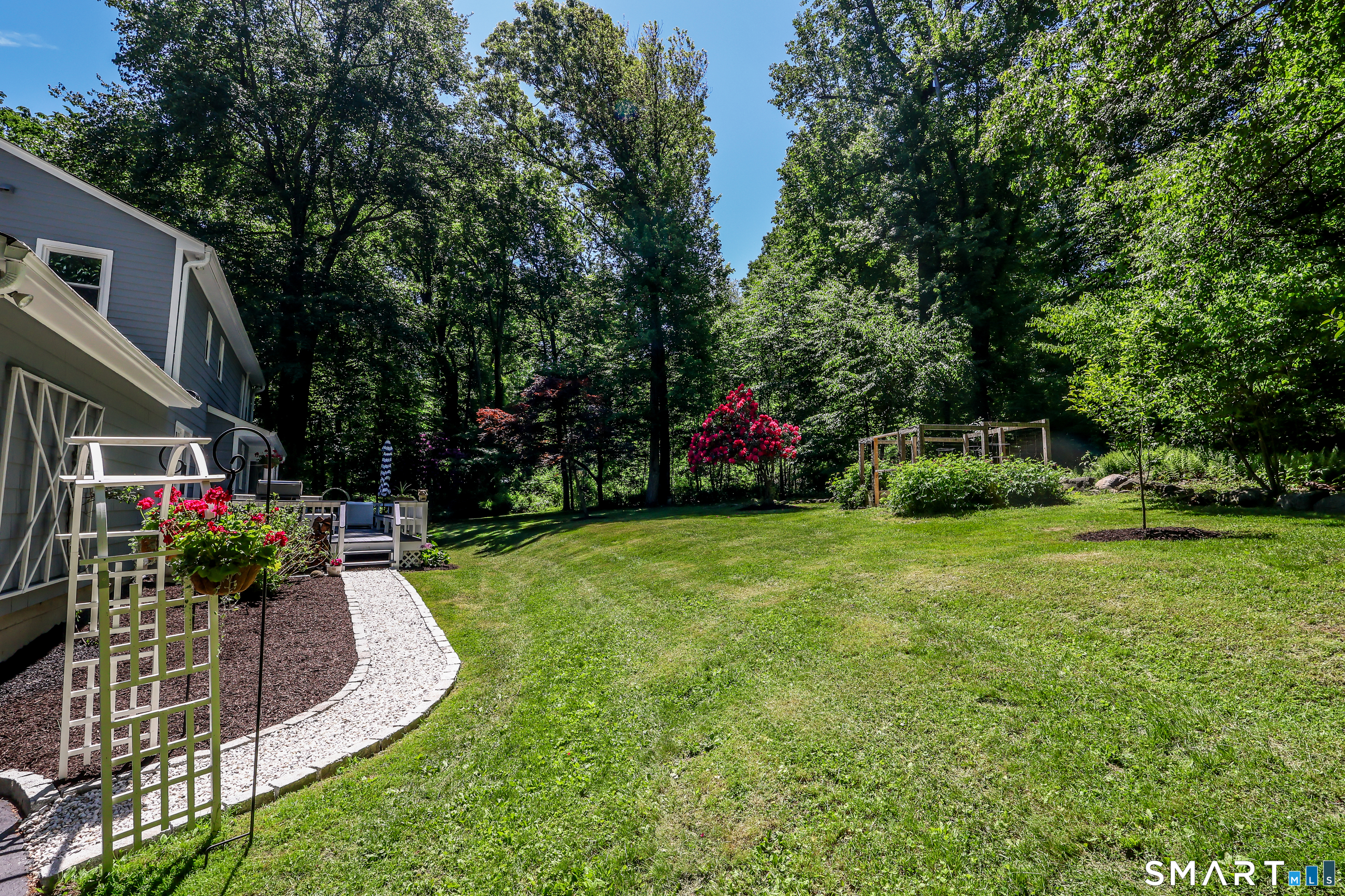 23 Old Green Road Newtown, CT 06482 - Photo 27 of 36 a view of a house with backyard and sitting area
