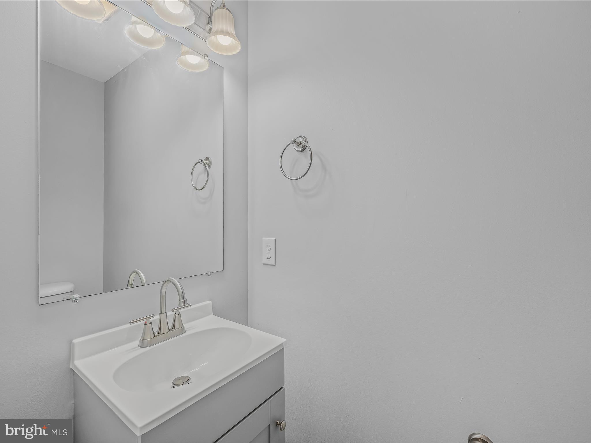 55 Stix Lane Inwood, WV 25428 - Photo 13 of 41 a bathroom with a sink vanity and a mirror