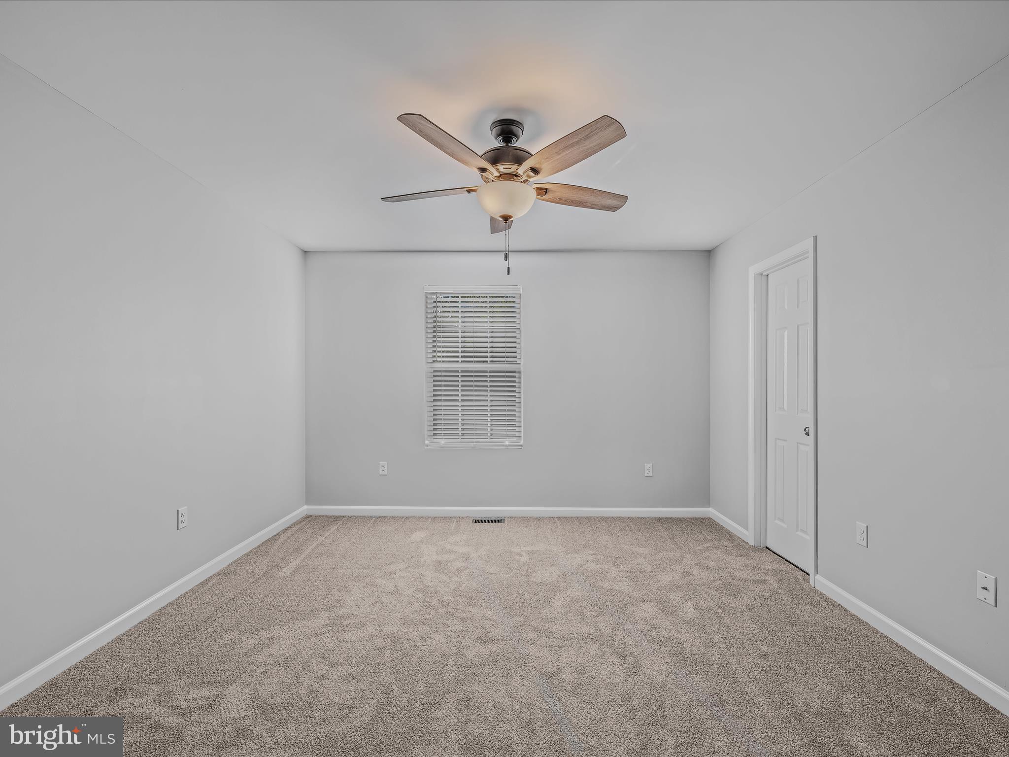 55 Stix Lane Inwood, WV 25428 - Photo 14 of 41 an empty room with windows and fan
