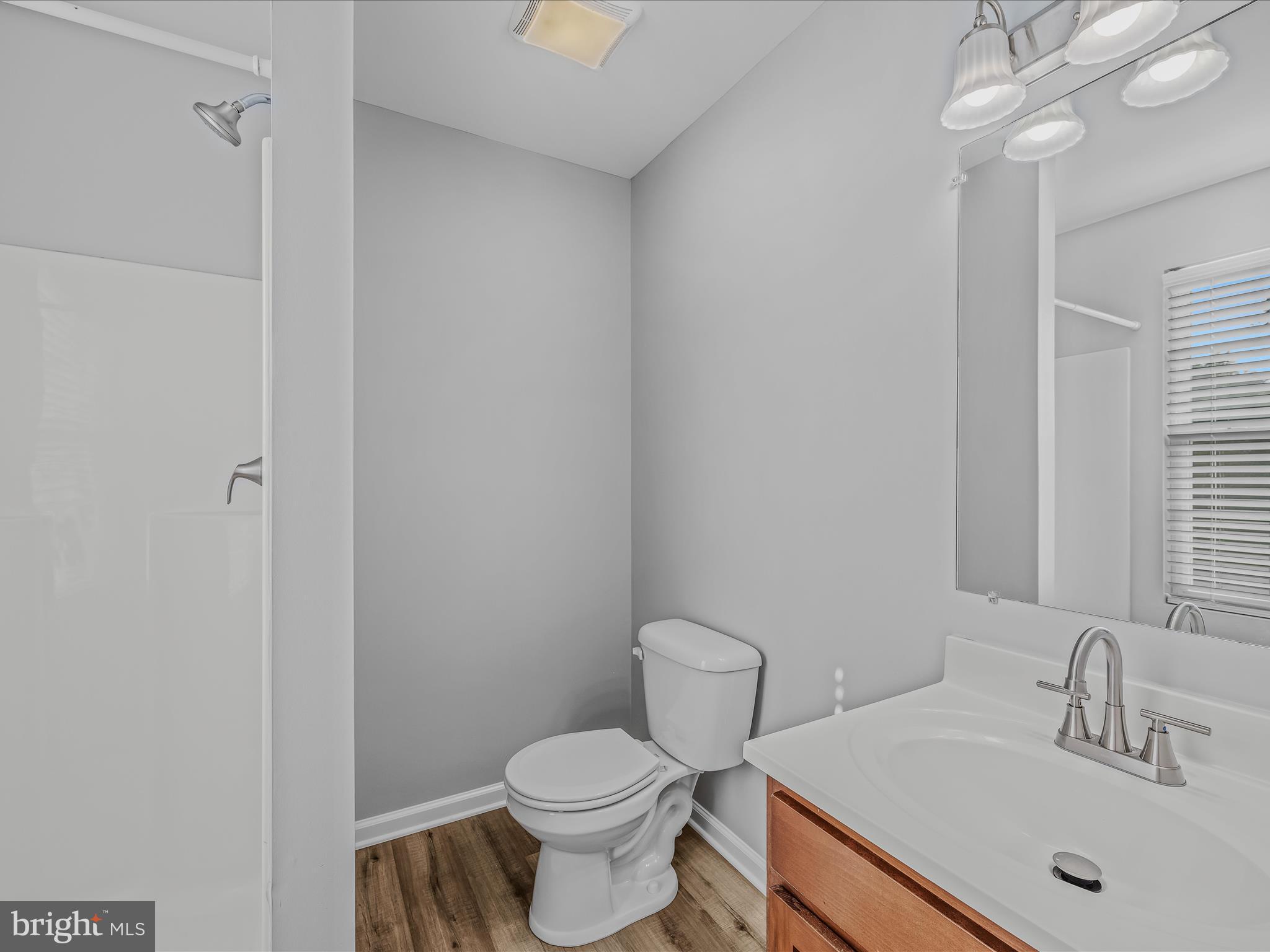 55 Stix Lane Inwood, WV 25428 - Photo 17 of 41 a bathroom with a sink a toilet and shower
