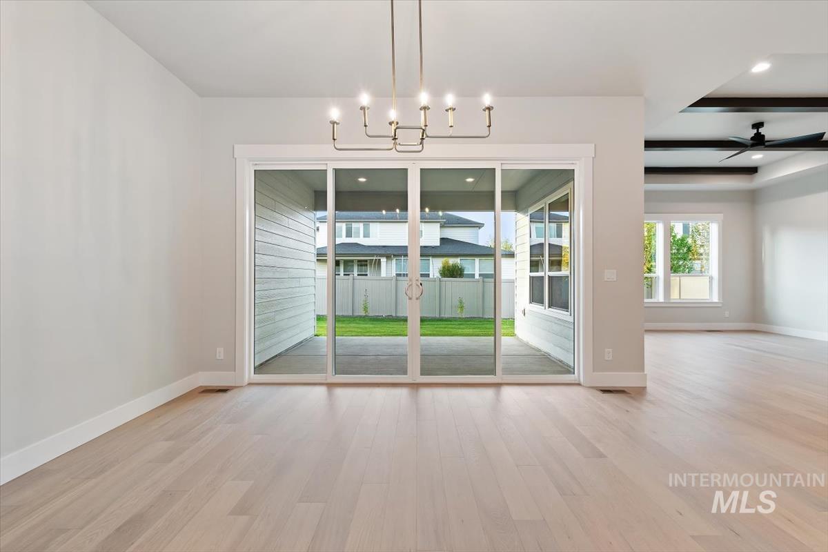 2147 East Blakehurst Avenue Kuna, ID 83634 - Photo 18 of 43 Unfurnished dining area featuring light wood-style flooring, ceiling fan, and recessed lighting