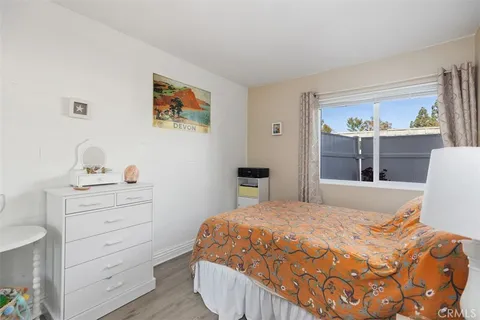 a bedroom with a bed and with cabinet