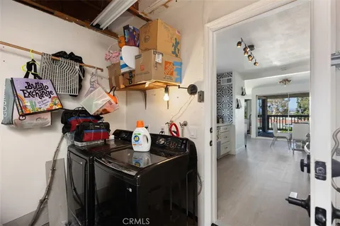 a kitchen with stainless steel appliances granite countertop a stove and a dining table