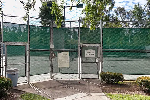 a view of a gate with a fence