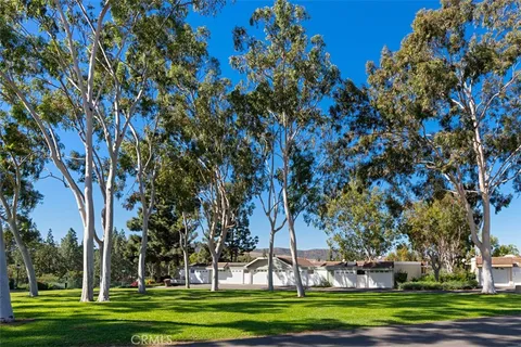 a view of a swimming pool and lounge chairs