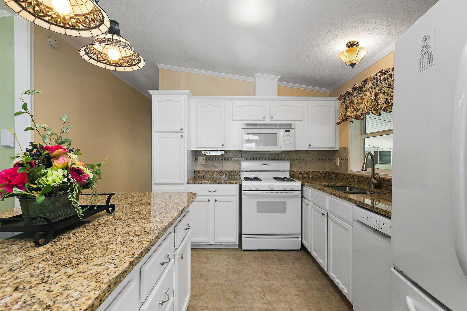 1054 Lakeview Road Elgin, IL 60123 - Photo 13 of 30 a kitchen with a sink stove and refrigerator