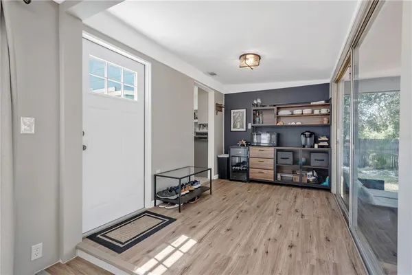 a room with furniture and wooden floor
