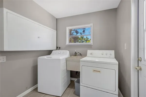 a utility room with dryer and washer