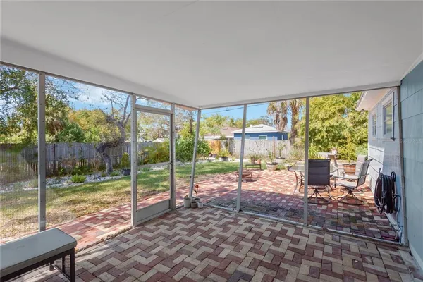 a view of a living room and floor to ceiling window
