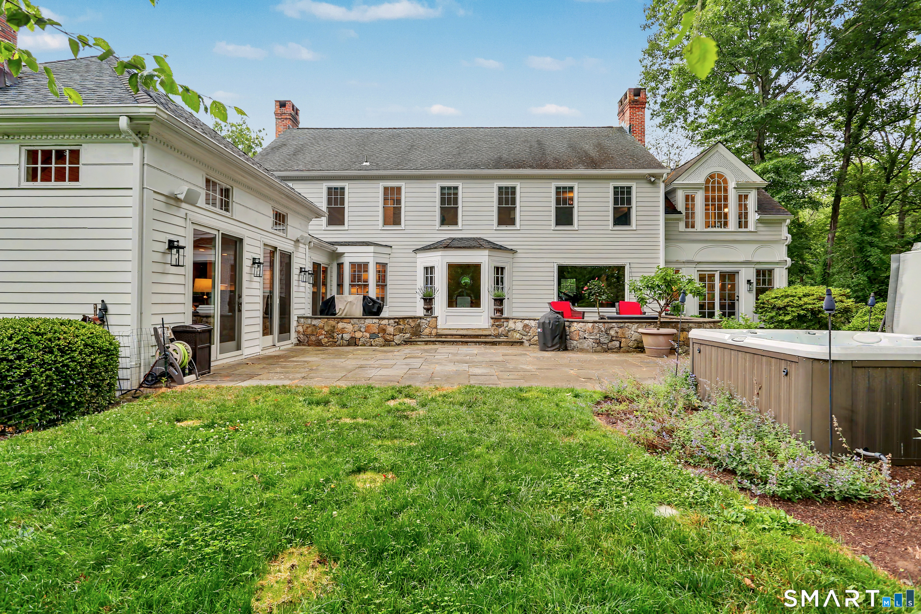 108 Logan Road New Canaan, CT 06840 - Photo 37 of 40 a front view of a building with garden