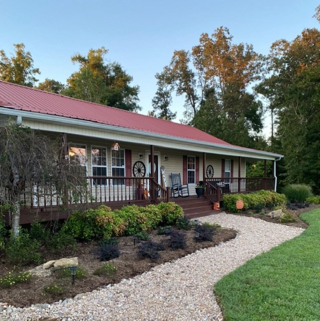 670 Armstrong Road Southeast Cleveland, TN 37323 - Photo 2 of 16 a front view of a house with garden and patio