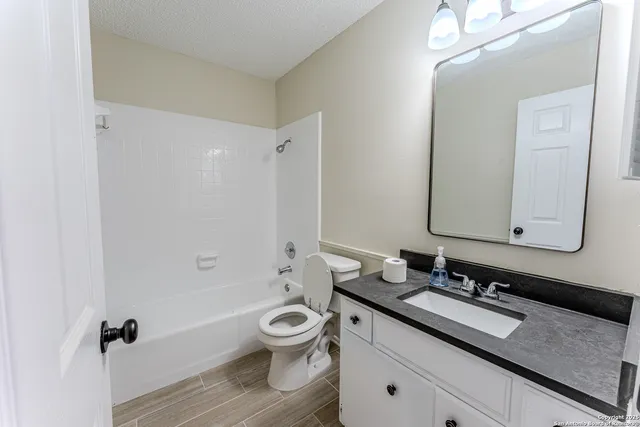 a view of room with wooden floor and window